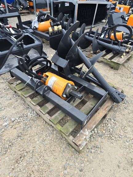 wolverine mini skid steer auger|who makes wolverine attachments.